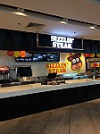 Sizzlin' Steak inside