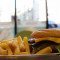 Beef Burger With Cheese And Chips On The Side